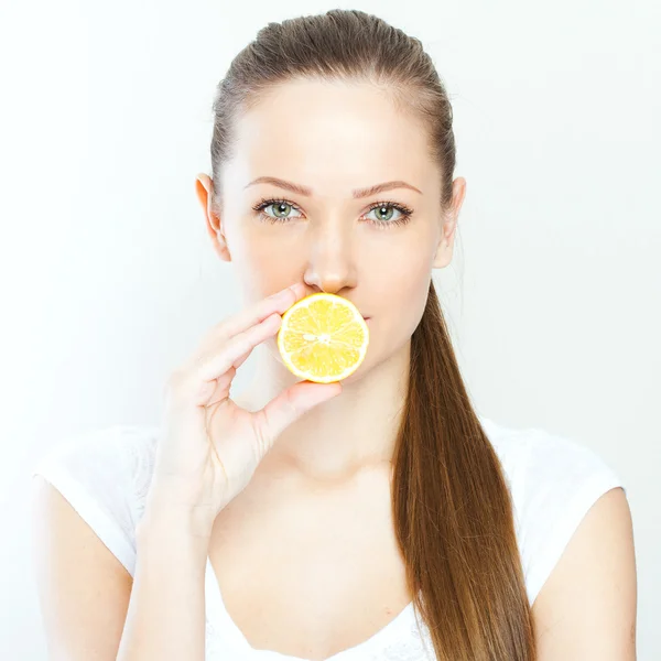 Portrait of young happy smiling woman with lemon — Stock Photo, Image