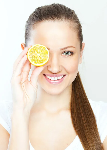 Portrait of young happy smiling woman with lemon — Stock Photo, Image