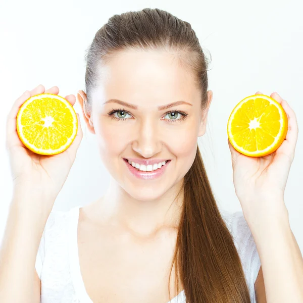 Portrait of a young beautiful woman with orange — Stock Photo, Image