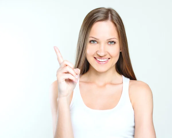 Beautiful woman pointing on the blank space — Stock Photo, Image