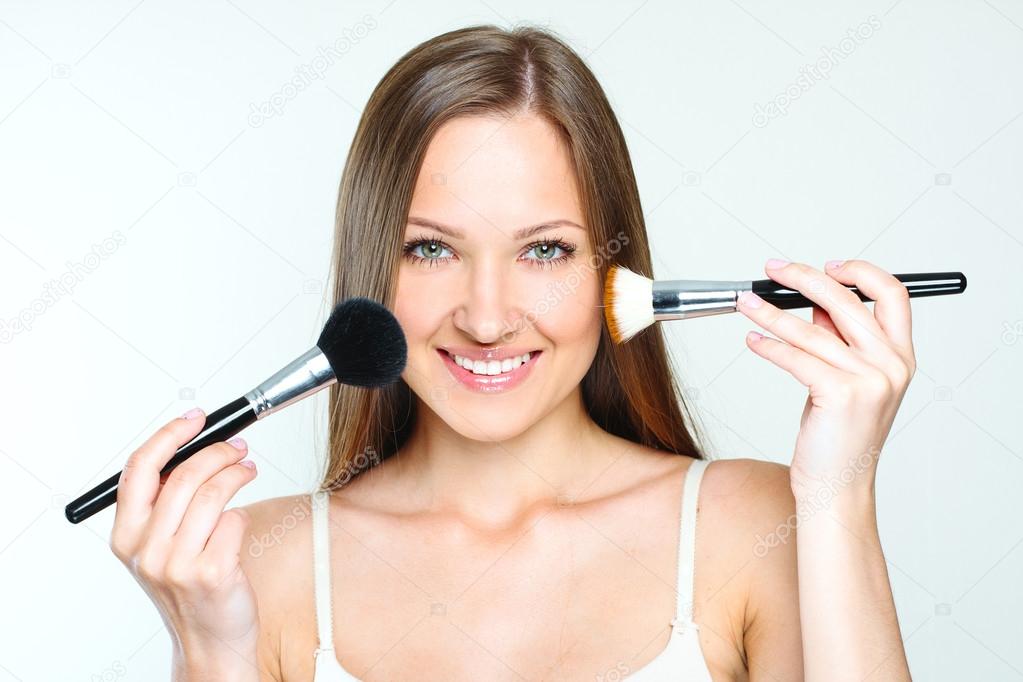 Beautiful woman making makeup