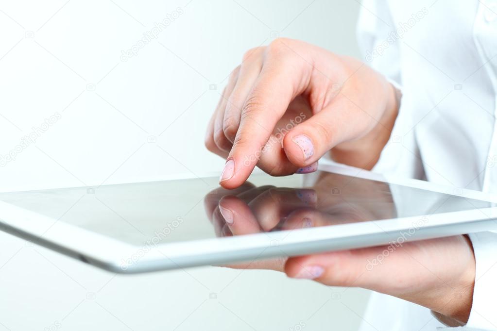 Female hands holding tablet pc