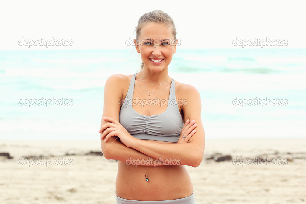 Athlete girl on the beach after workout