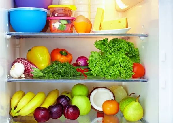 Refrigerator full of healthy food. fruits and vegetables Stock Photo