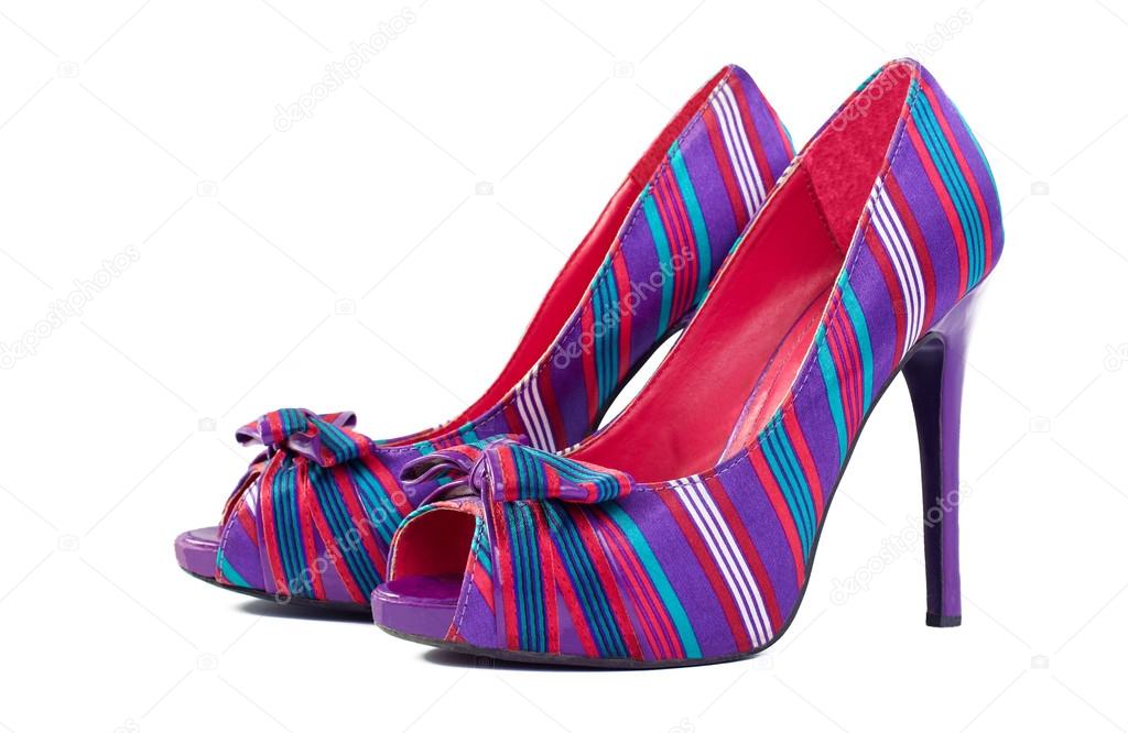 A pair of colorful high-heel shoes isolated on white