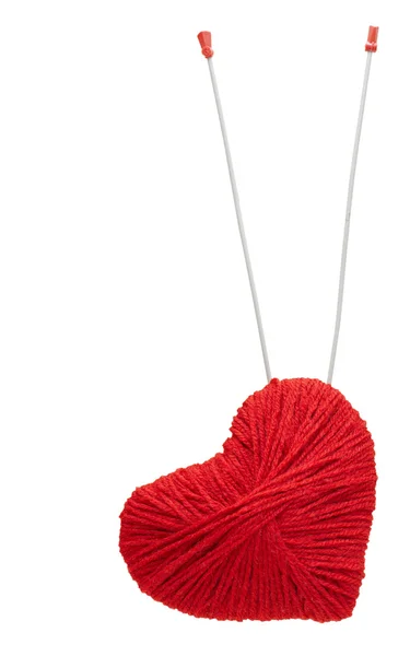 Red yarn heart with spoke arrows, isolated on white — Stock Photo, Image