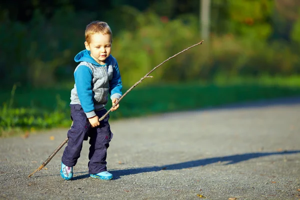 Baby boy riding an imaginary horse — Stock Photo, Image