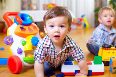 Curious boy in nursery room clipart