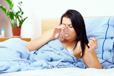 Young woman feels thirsty in the morning clipart