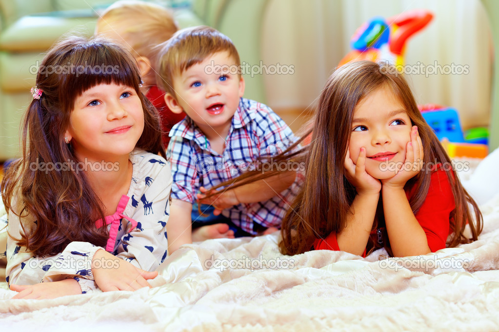 Group of cute children listen attentively