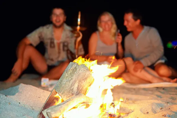 Happy having fun around the bonfire — Stock Photo, Image