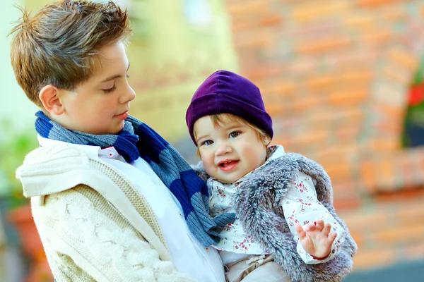 Outdoor portrait of cute brother and sister — Stock Photo, Image