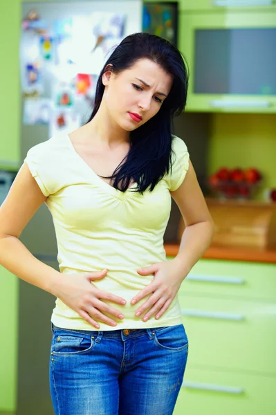 Young woman feels sick, home interior — Stock Photo, Image