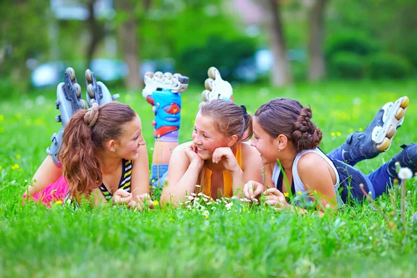 Happy teenage friends having fun in spring park — Stock Photo, Image