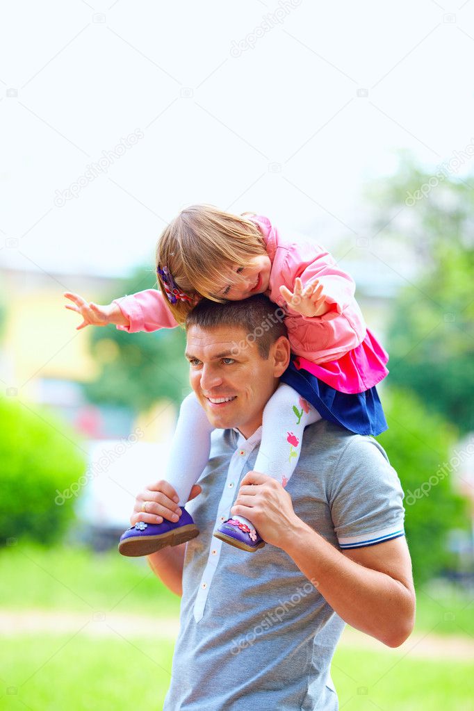 happy father and baby girl having fun outdoors