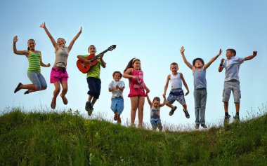 happy kids jumping on summer field clipart