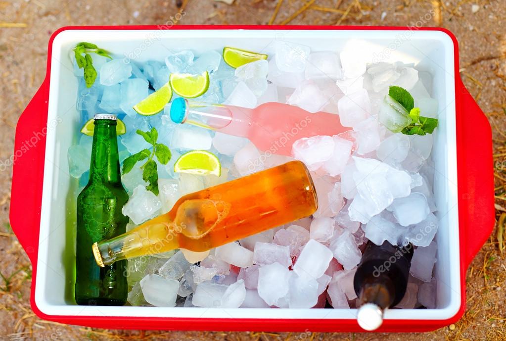 Chilled colorful beverages in ice box. summer party