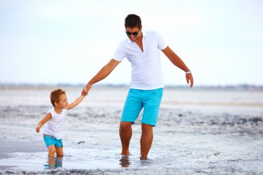 father and son overcome obstacles together, salted firth clipart