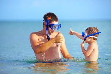 happy father and son snorkeling clipart