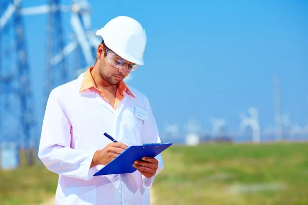 Researcher analyzes readouts on wind power station — Stock Photo, Image