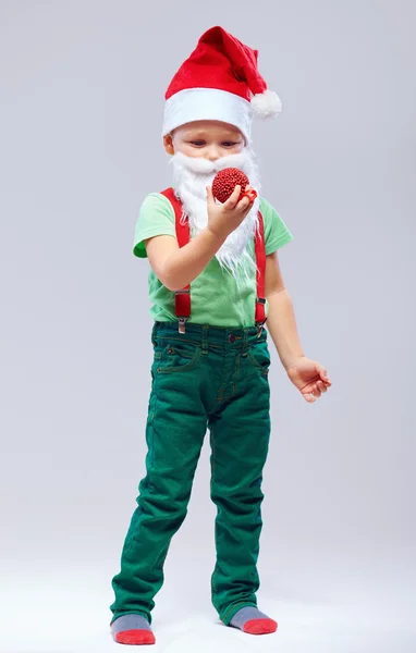 Cute kid santa claus with christmas toy — Stock Photo, Image