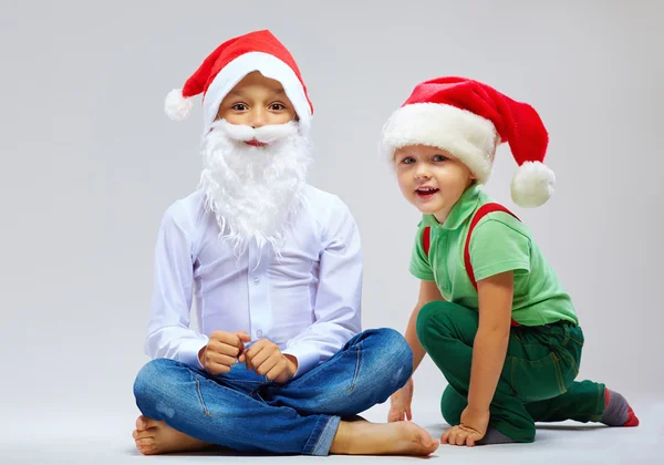 Cute santa claus and little helper on white — Stock Photo, Image