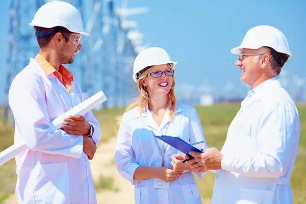Group of researchers on wind power station — Stock Photo, Image
