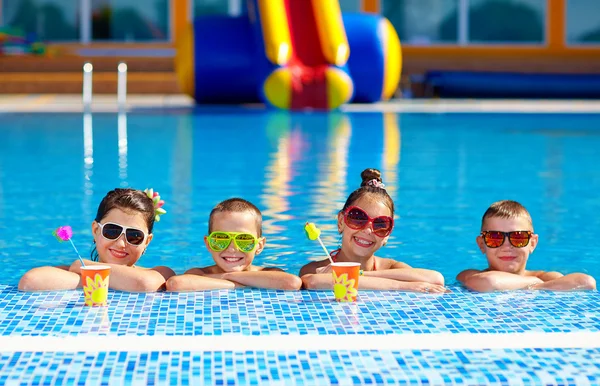 Group of happy teenage kids in the pool — Stock Photo, Image