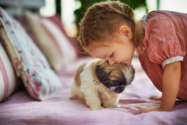 Cute Baby Girl Cuddling Puppy Dog Summer Patio Home — Stock Photo, Image