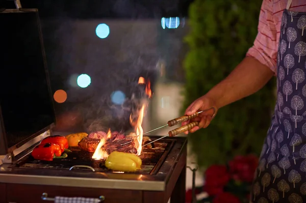 Man Grilling Food Bbq Patio Summer Evening — Stock Photo, Image