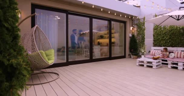 Man Opens Sliding Doors Going Out Rooftop Patio Cozy Lounge — Stock Video