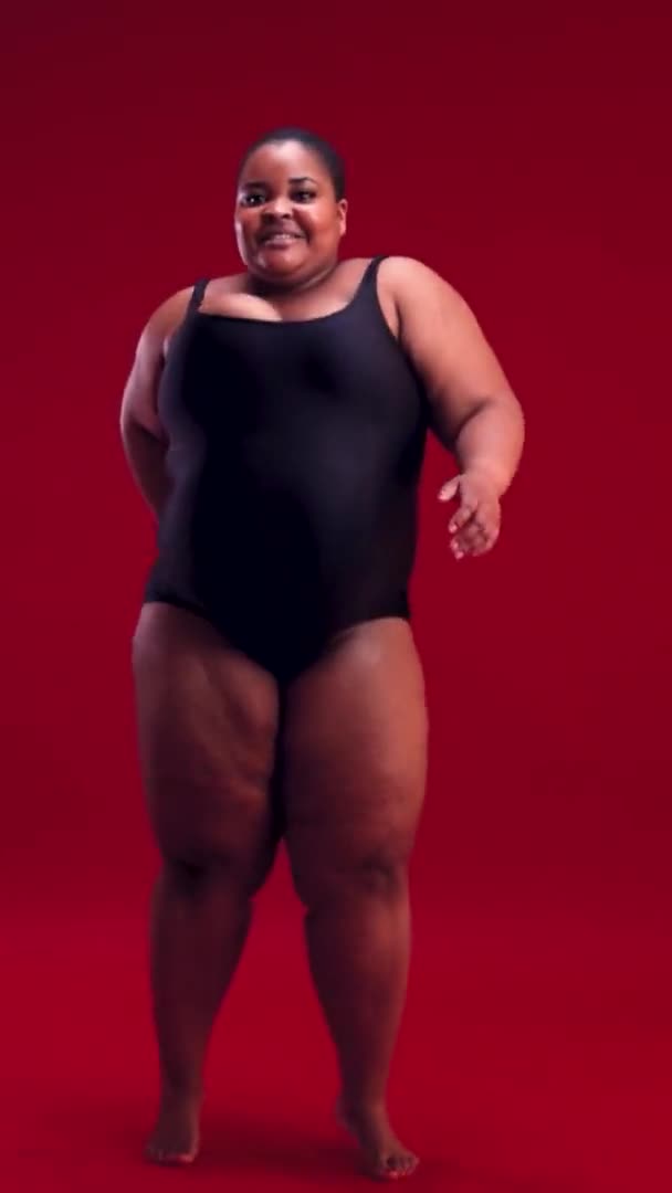Smiling Young Size Woman Swimsuit Posing Red Background Diverse Beauty — Stock Video