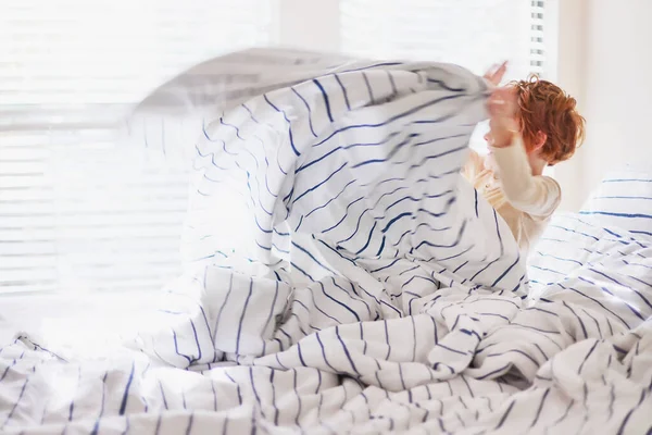 Blurred Redhead Boy Waking Morning Bright Bedroom Sunlited Morning Beams Fotos De Bancos De Imagens Sem Royalties