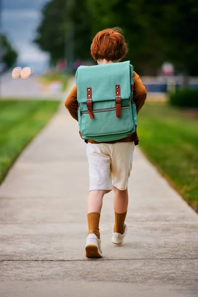 Rear View Cute Redhead School Boy Kid Backpack Walks Street Stock Photo