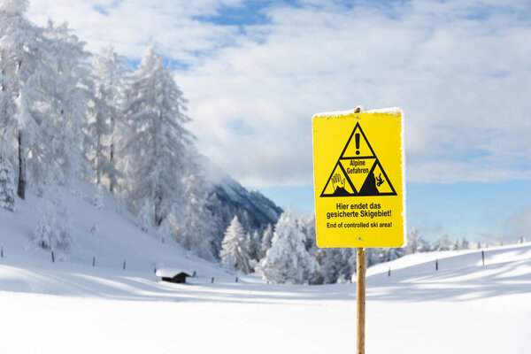 Sign board in mountains End of controlled ski area