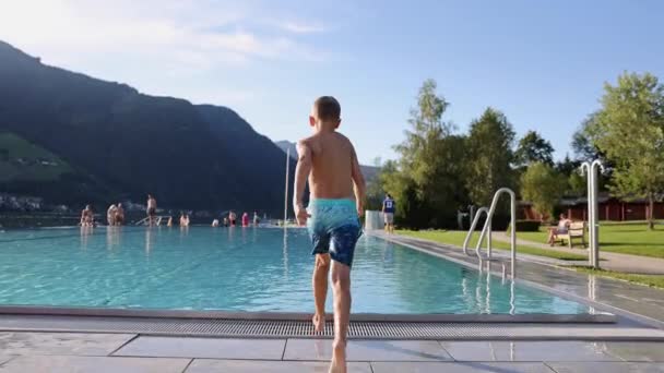 Footage Boy Jumping Outdoor Pool Alps Summer Holiday Concept High — Stock video