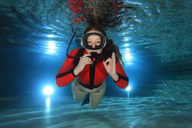 Scuba woman diving in the pool clipart