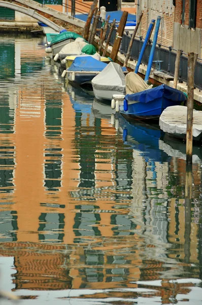 Boats line a Venice canal — Stock Photo, Image