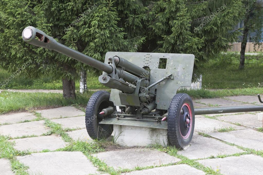 Artillery gun ZIS-3 in the square near the monument to fallen soldiers in World War II The village Syamzha, Vologda region, Russia