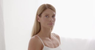 Mature old lady close up portrait. Beautiful gorgeous 50s mid aged mature woman looking at camera isolated on white. Healthy face skin care beauty, middle age skincare cosmetics, cosmetology concept 