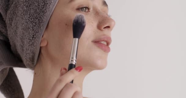 Beauty Routine Satisfied Young Woman Applying Foundation Brush Morning Shower — Αρχείο Βίντεο