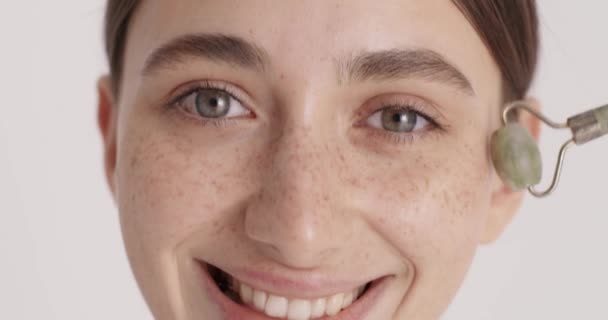 Close Portrait Attractive Young Woman Massaging Her Cheek Quartz Massage — Vídeos de Stock