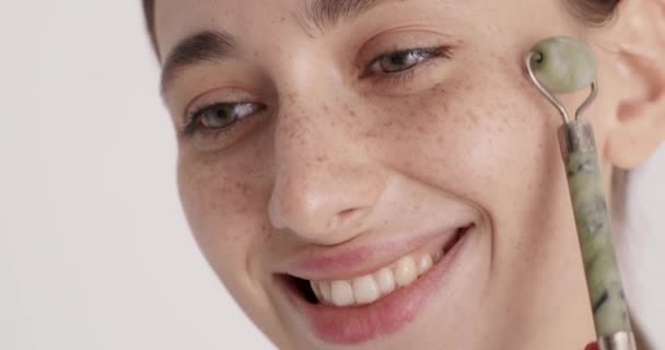 Facial Rejuvenation Young Positive Woman Massage Facial Skin Natural Jade — Vídeos de Stock