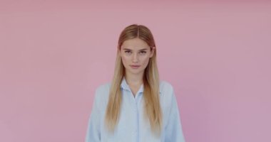 Portrait of extremely happy girl laughing out loud, chuckling giggling at amusing anecdote, sincere emotion. Indoor studio shot isolated on pink background 