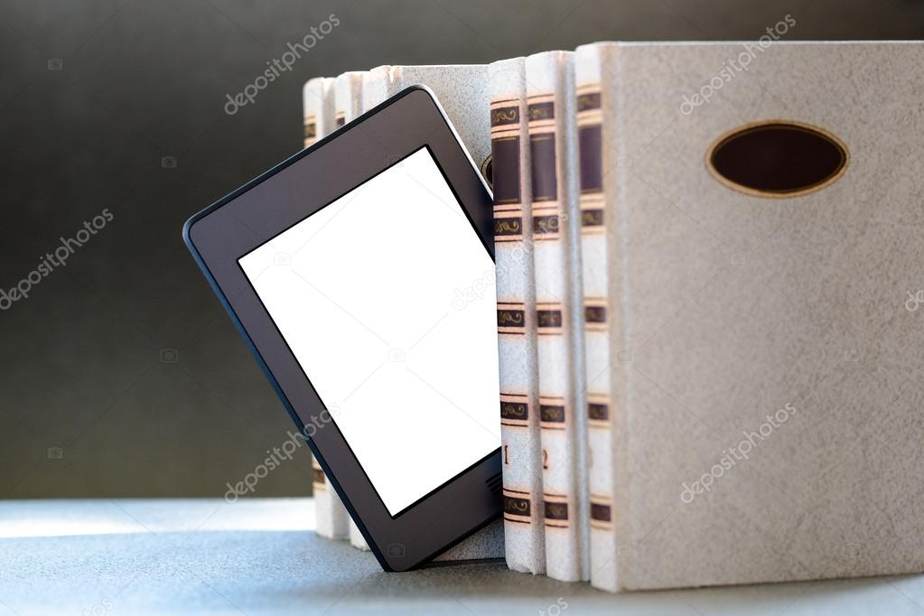 Ebook and books on table
