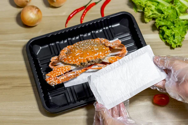 crab on plastic packaging with food absorbent in supermarket, Good quality for food store