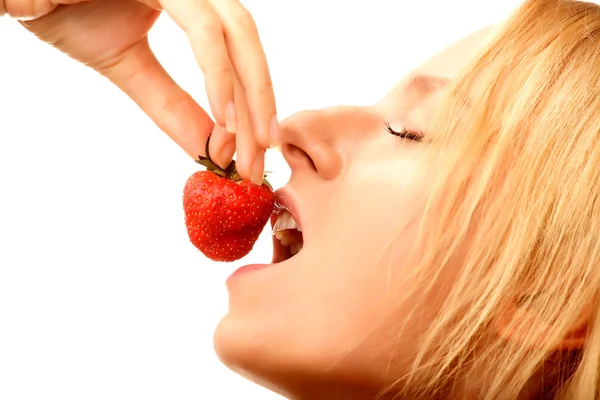 Happy girl eating strawberries — Stock Photo, Image