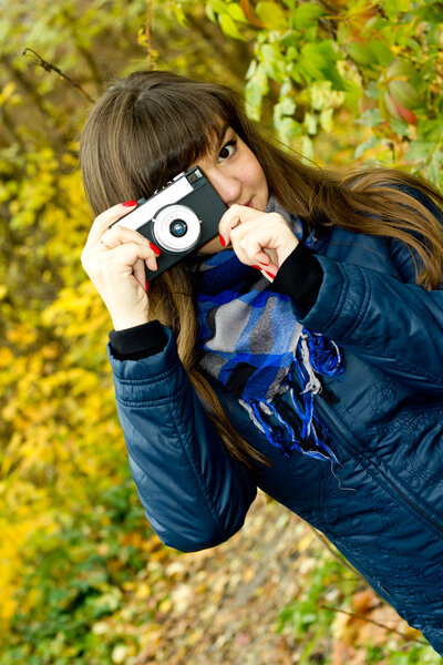 A girl takes a picture on the camera