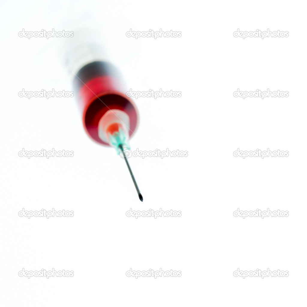 Needle and syringe containing red liquid.