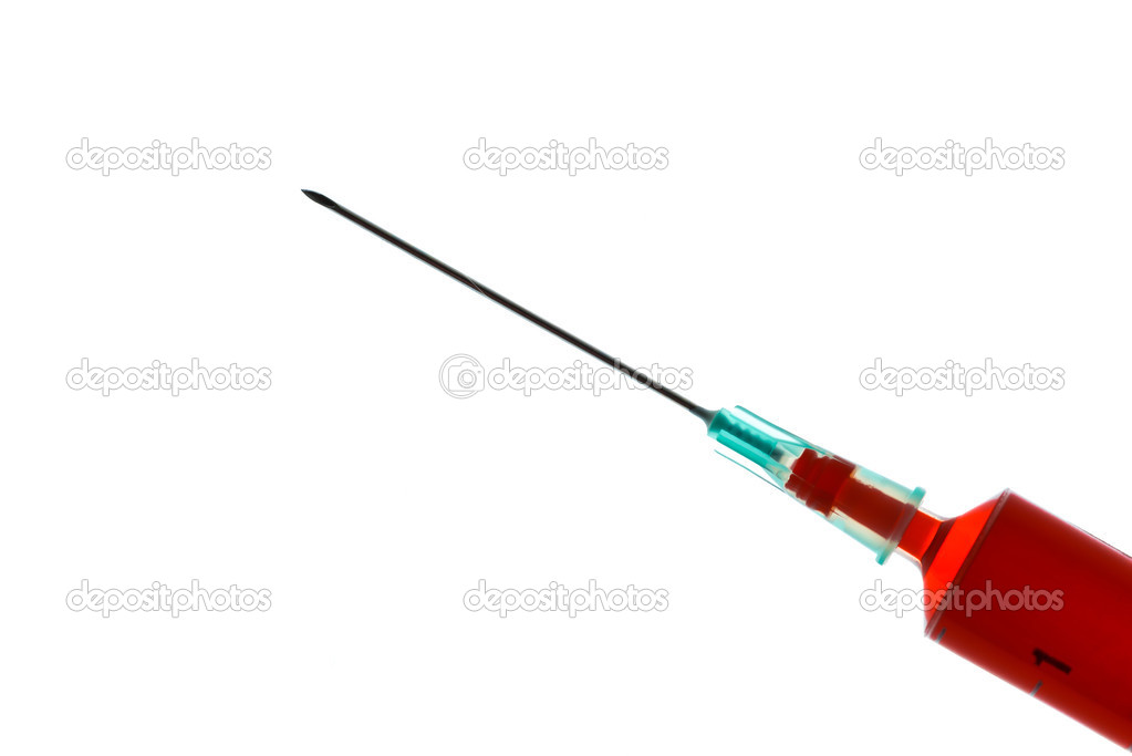 Red liquid in a syringe with needle attached